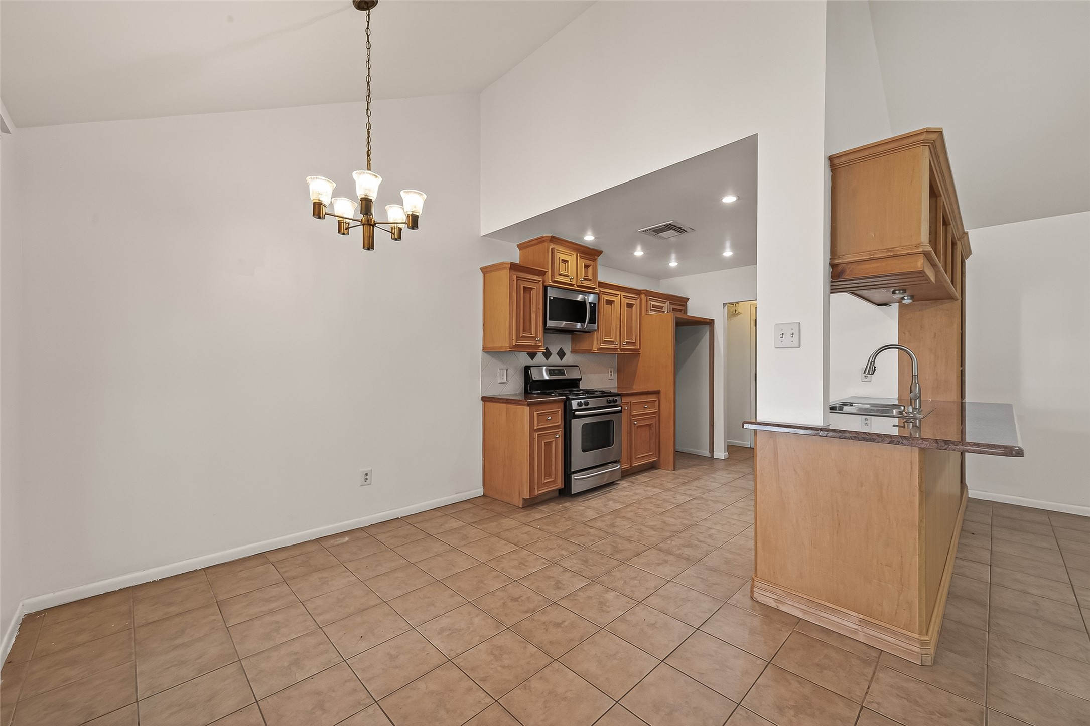 2510 Old Fort Road Sugar Land, TX 77479 - Photo 15 of 41 a kitchen with stainless steel appliances granite countertop a refrigerator and a stove top oven