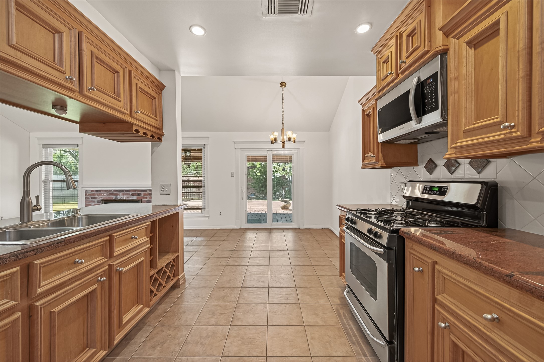 2510 Old Fort Road Sugar Land, TX 77479 - Photo 20 of 41 a kitchen with stainless steel appliances granite countertop a stove and a sink