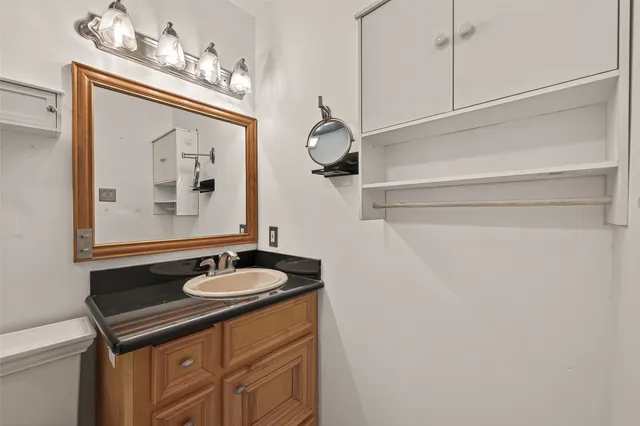 a bathroom with a sink and a mirror