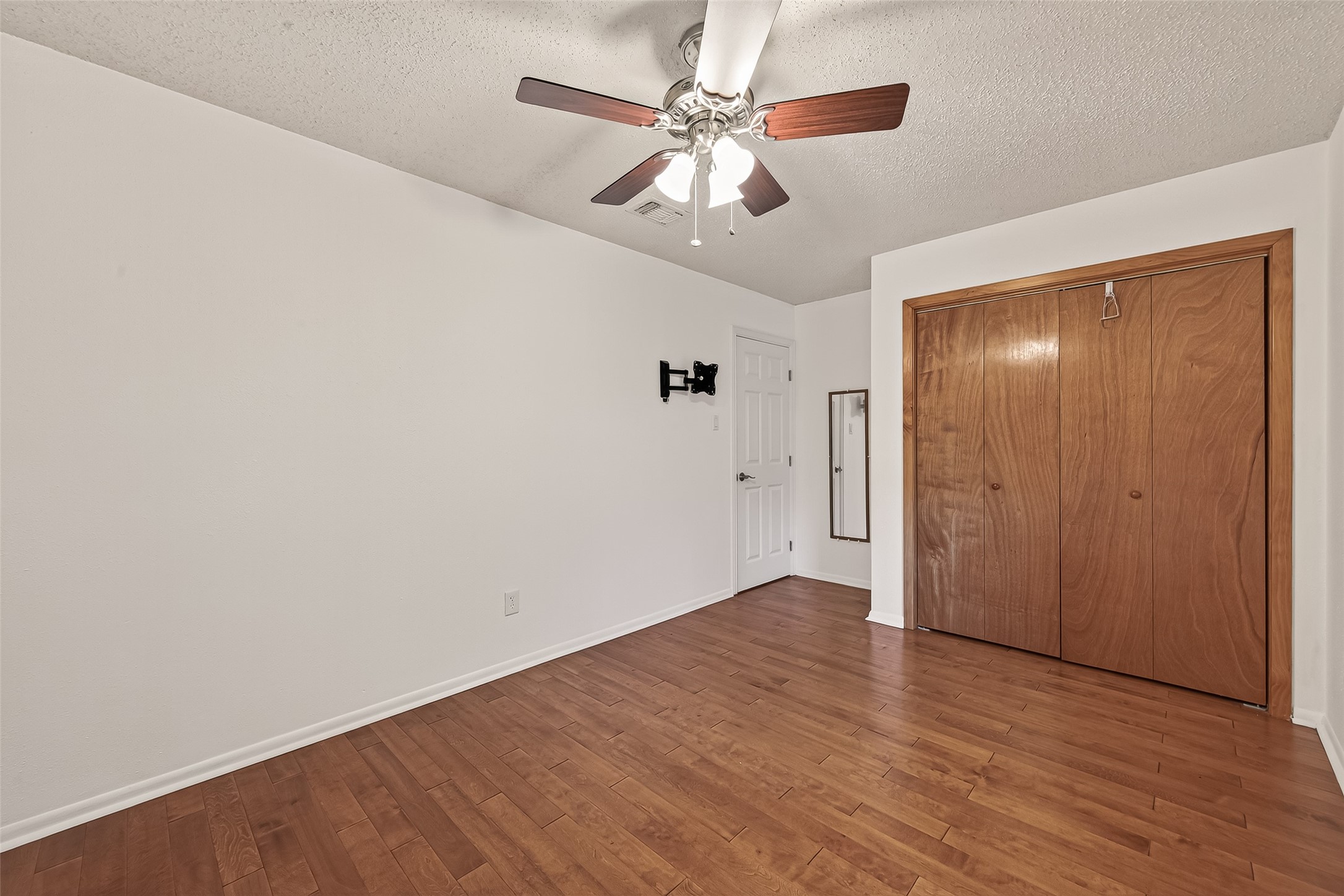 2510 Old Fort Road Sugar Land, TX 77479 - Photo 28 of 41 a view of an empty room with wooden floor