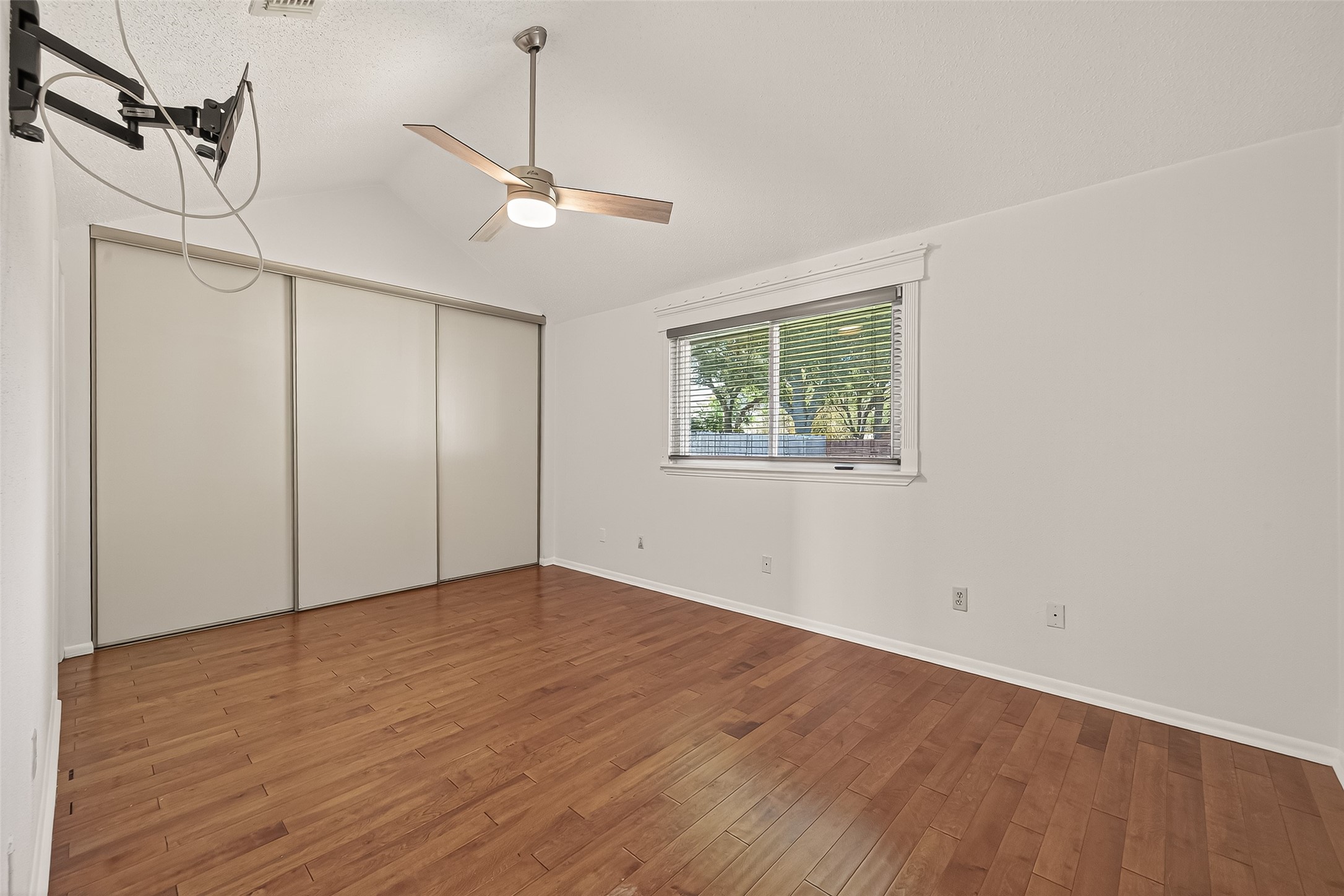 2510 Old Fort Road Sugar Land, TX 77479 - Photo 30 of 41 a view of an empty room with wooden floor and a window
