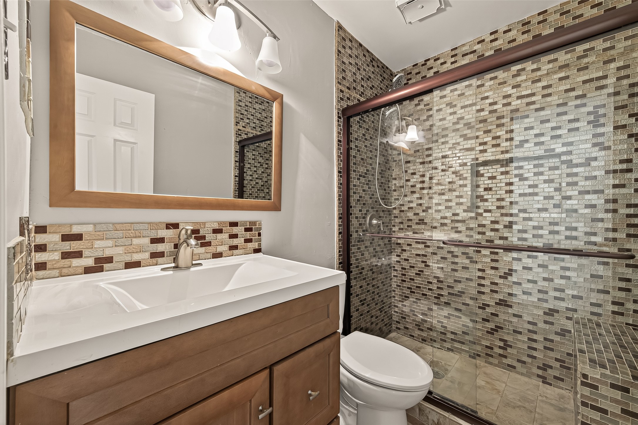 2510 Old Fort Road Sugar Land, TX 77479 - Photo 34 of 41 a bathroom with a sink a toilet and shower curtain
