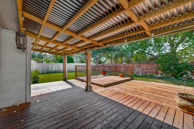 a view of a patio with wooden floor