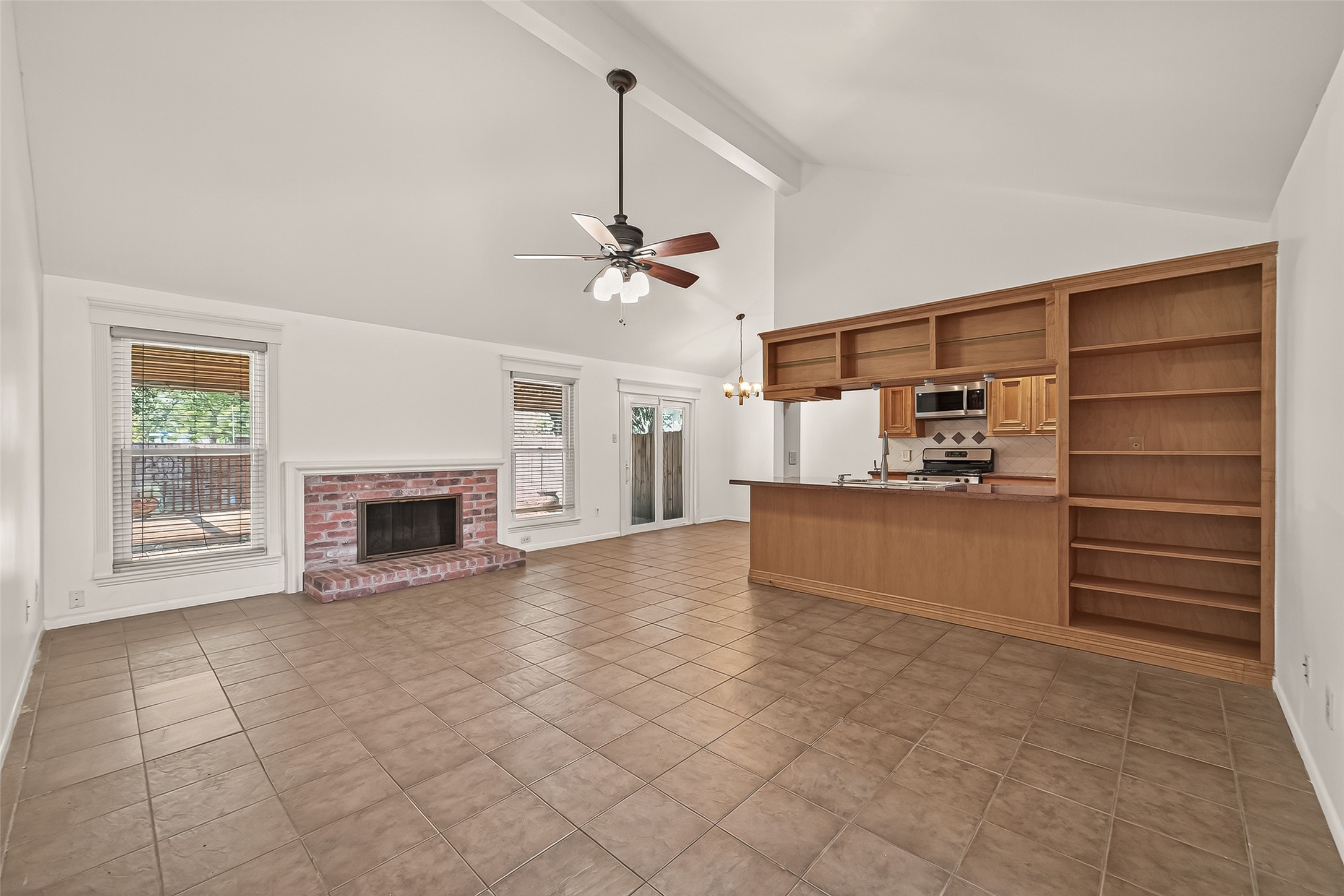 2510 Old Fort Road Sugar Land, TX 77479 - Photo 10 of 41 a view of a kitchen with furniture and a fireplace