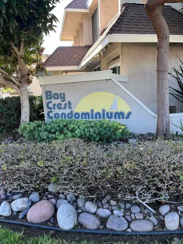 a sign that is sitting in front of a house