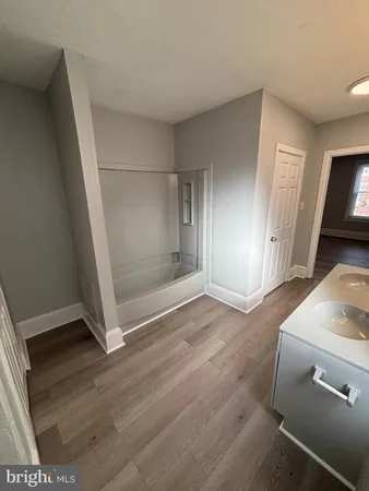 a en suite bathroom with a sink and mirror