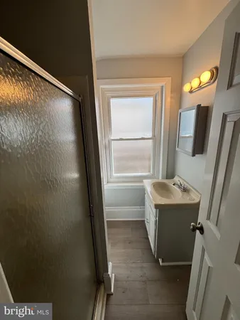 a bathroom with a sink and a shower