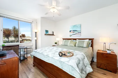 a bedroom with a bed and a table in it