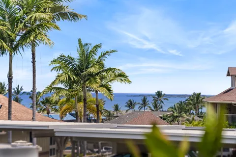 a view of a dining room with table and chairs