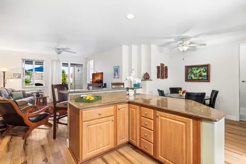 a kitchen with stainless steel appliances granite countertop a sink and cabinets