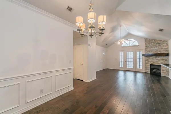 a view of a livingroom with wooden floor
