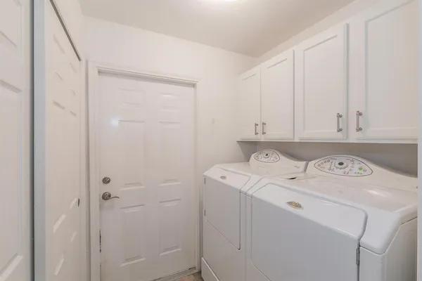 a utility room with dryer and washer