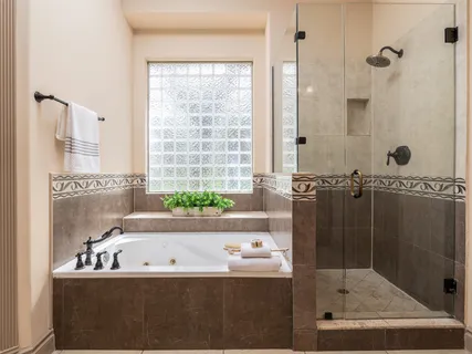 a bath tub sitting next to a bathroom sink
