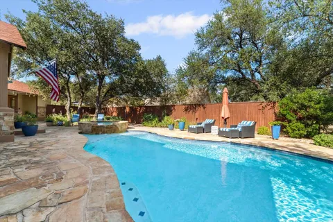 a view of a house with swimming pool