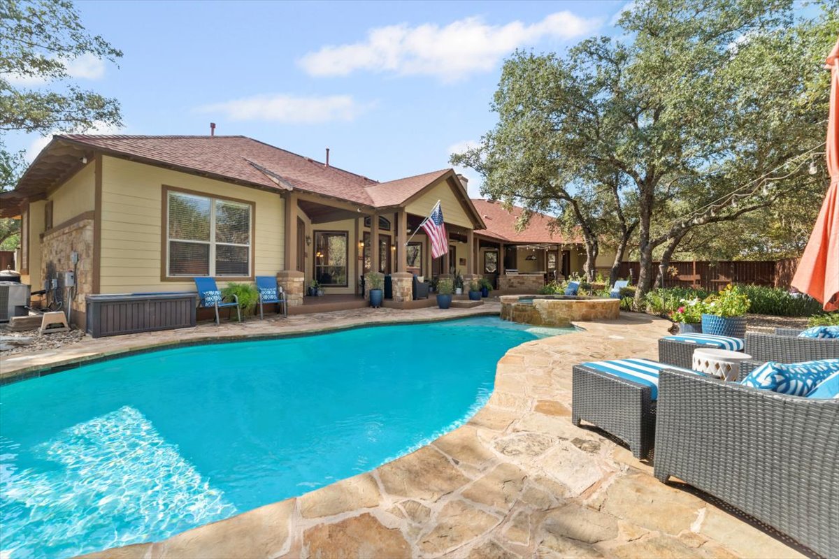 139 Ware Drive Buda, TX 78610 - Photo 34 of 39 Relaxing pool / spa with a patio area