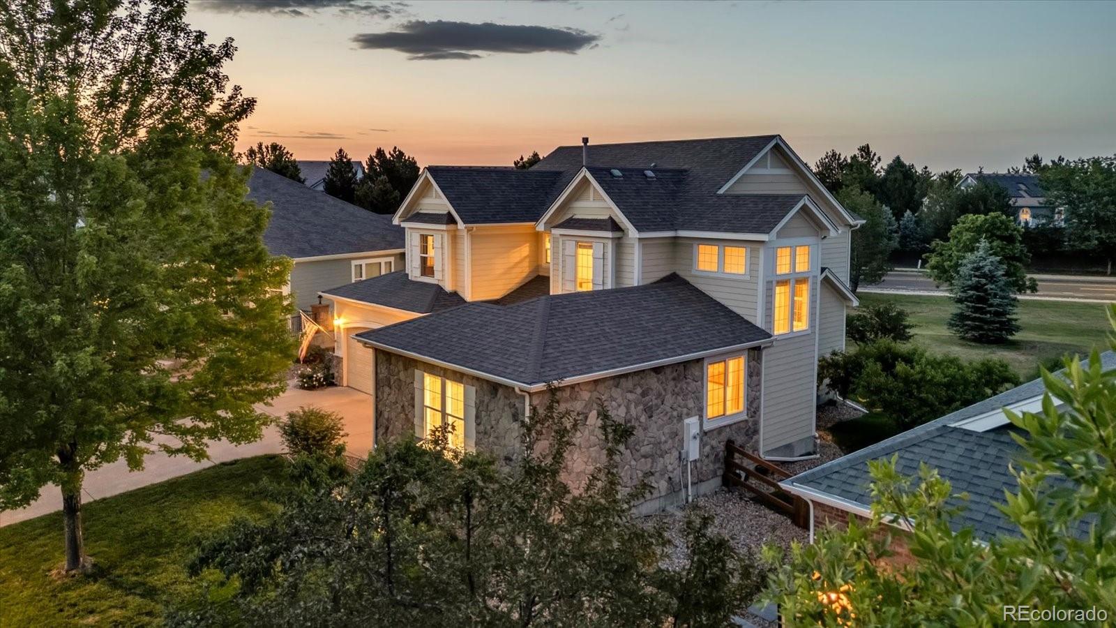 4786 Rabbit Mountain Road Broomfield, CO 80020 - Photo 2 of 41 an aerial view of house with yard and trees in the background
