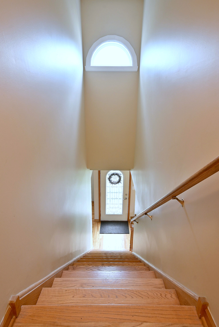 1495 East Algonquin Road Des Plaines, IL 60016 - Photo 25 of 41 a view of a hallway with wooden floor