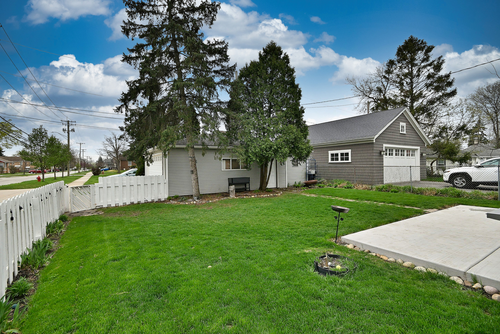 1495 East Algonquin Road Des Plaines, IL 60016 - Photo 41 of 41 a front view of a house with a yard and garage