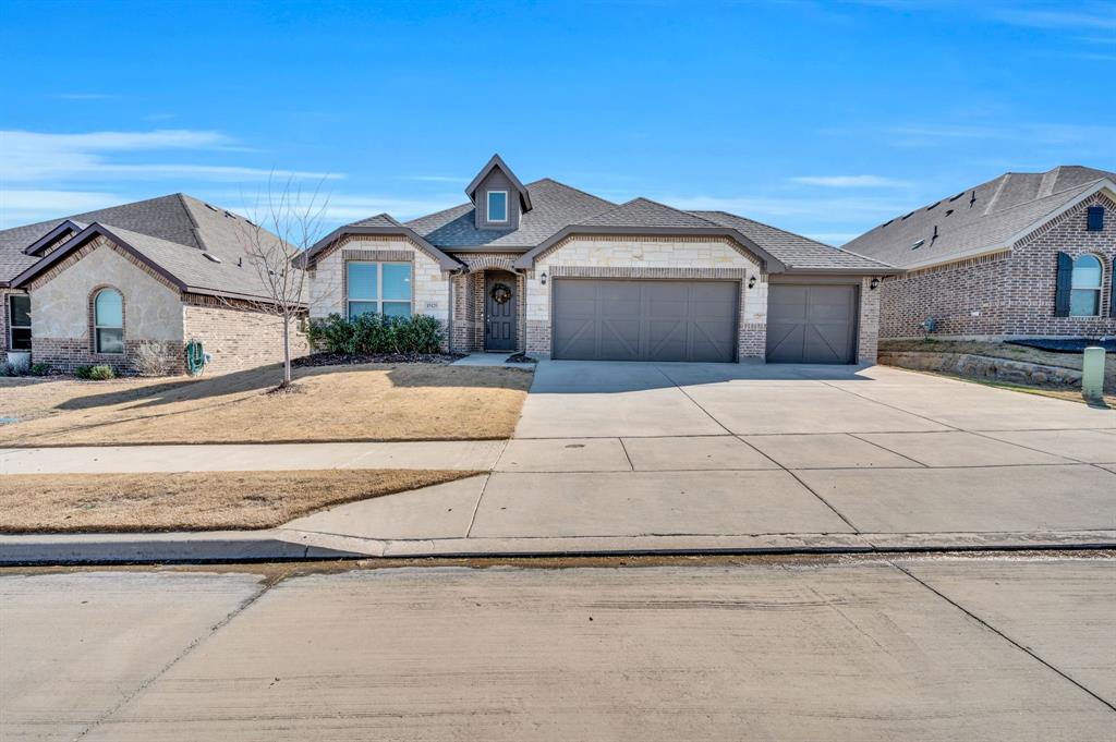 15125 Fleet Hill Road Aledo, TX 76008 - Photo 1 of 1 a front view of a house with a yard and garage