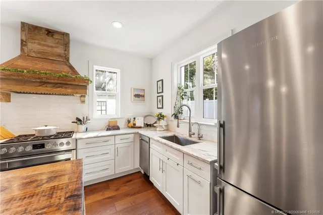 a view of a livingroom with furniture and a bookshelf