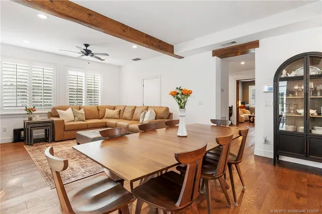 a bathroom with a bathtub shower sink mirror and a shower