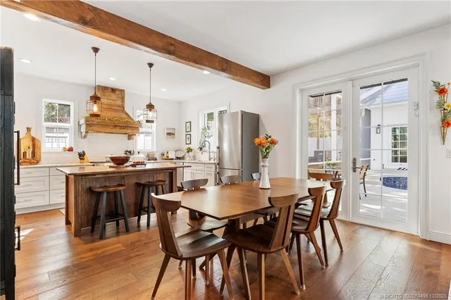 a bathroom with a tub toilet and shower