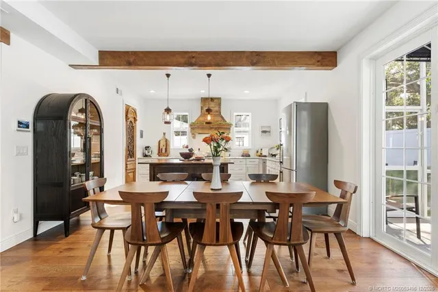 a bedroom with a bed and a table