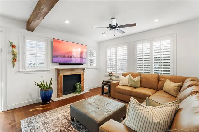 a bathroom with a granite countertop toilet sink and a mirror