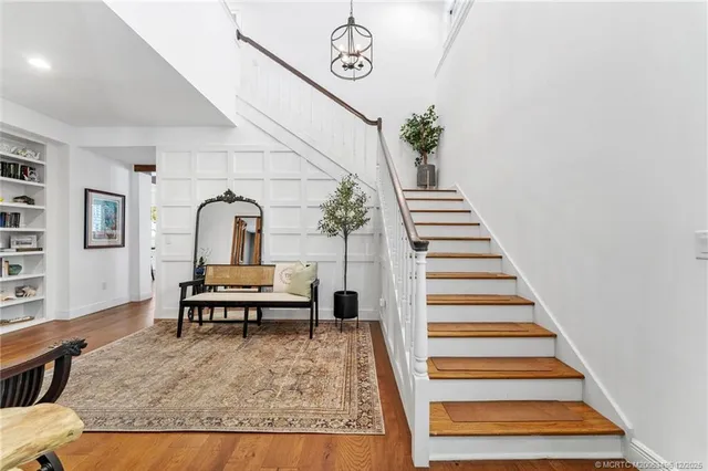 a view of a patio with table and chairs and potted plants