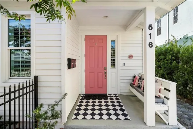 a view of a dining hall with furniture and wooden floor