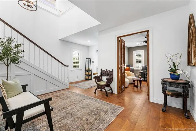 a kitchen with stainless steel appliances a sink stove and cabinets