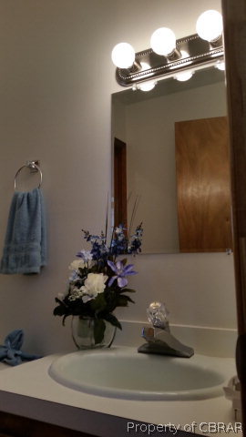 292 Evans Road Mathews, VA 23109 - Photo 28 of 37 a bathroom with a sink and a mirror