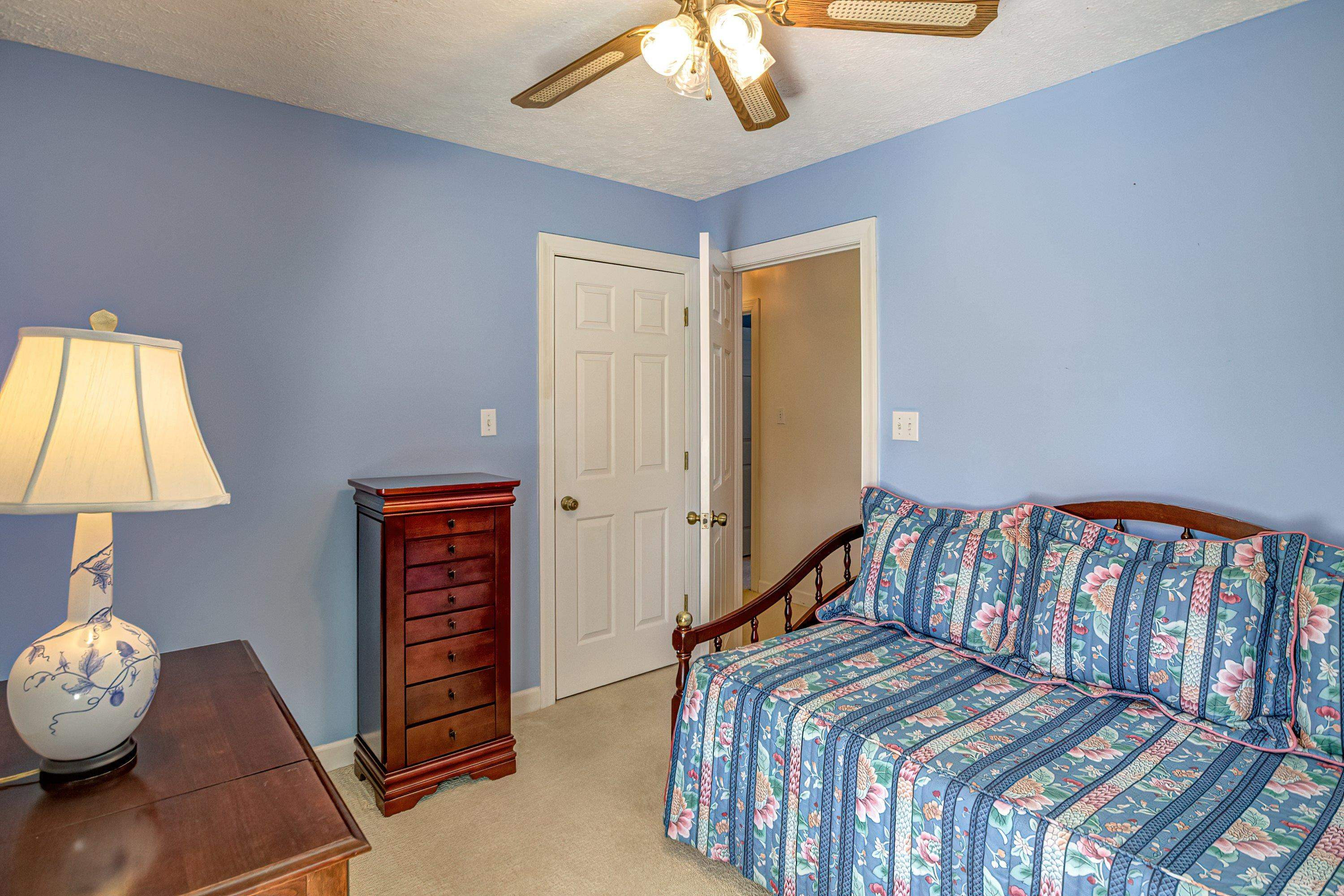 7191 Suttontown Road Faison, NC 28341 - Photo 12 of 40 a bedroom with furniture and a window