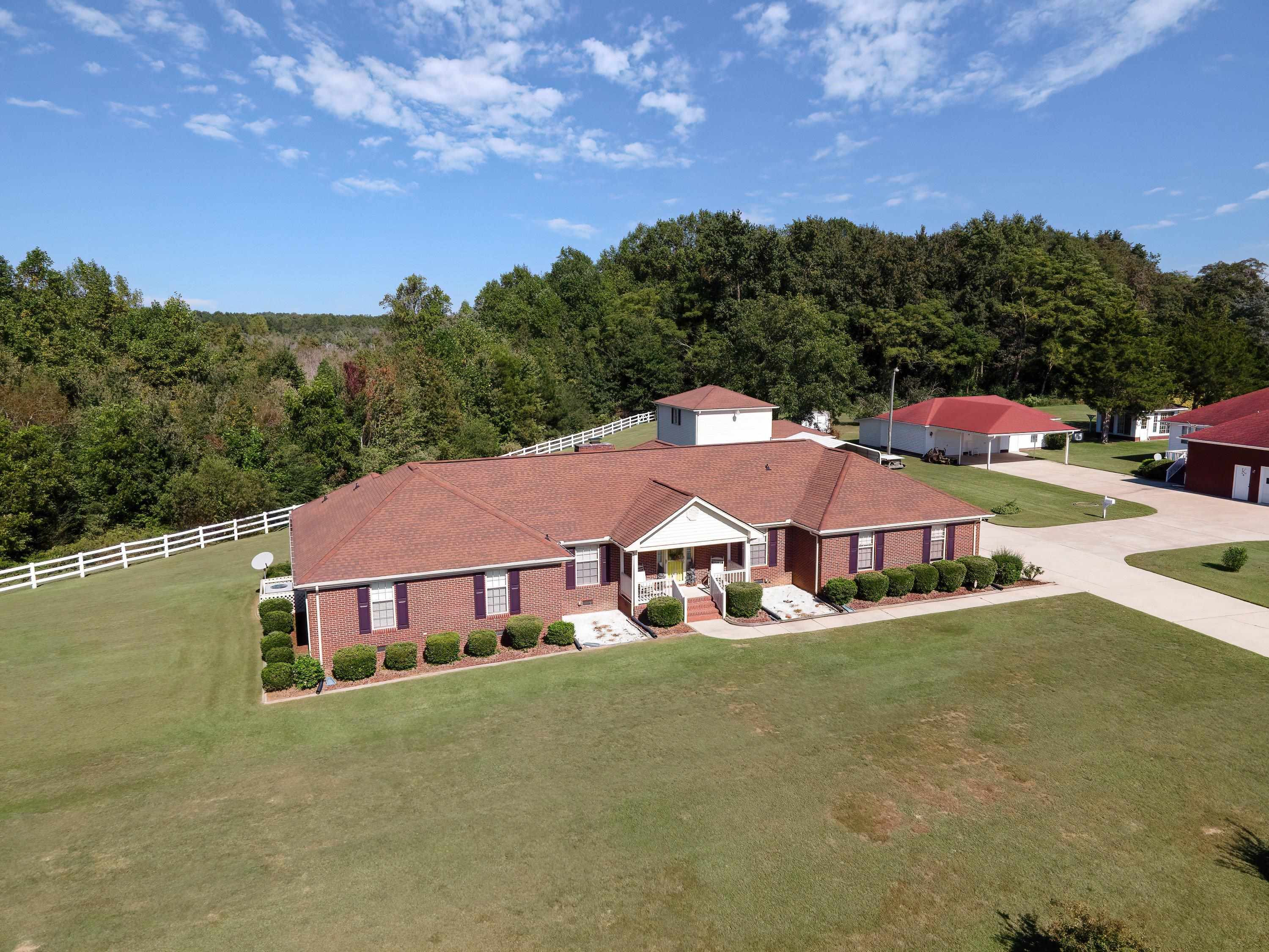 7191 Suttontown Road Faison, NC 28341 - Photo 2 of 40 a house with swimming pool in front of it