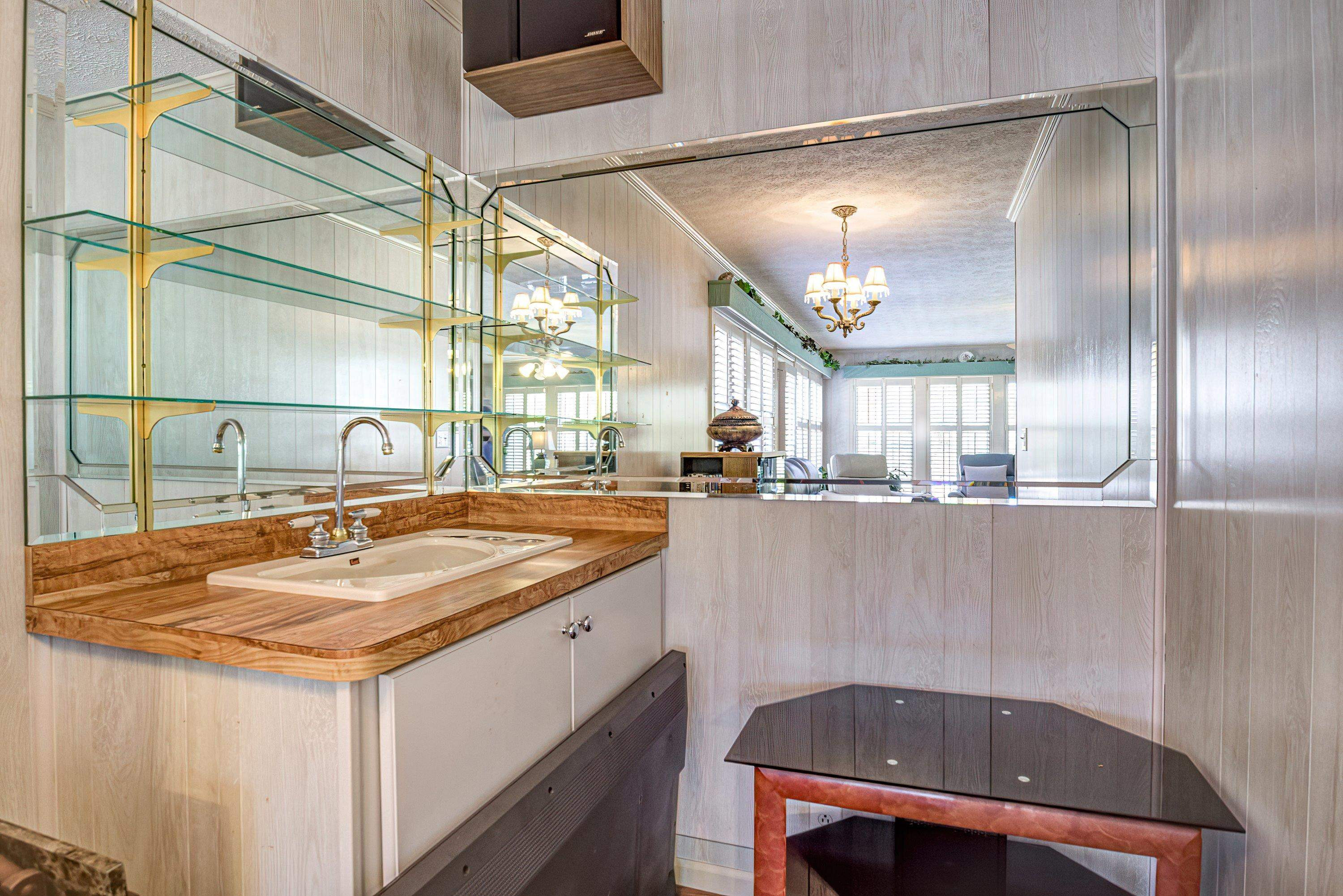 7191 Suttontown Road Faison, NC 28341 - Photo 22 of 40 a bathroom with a granite countertop sink and a mirror