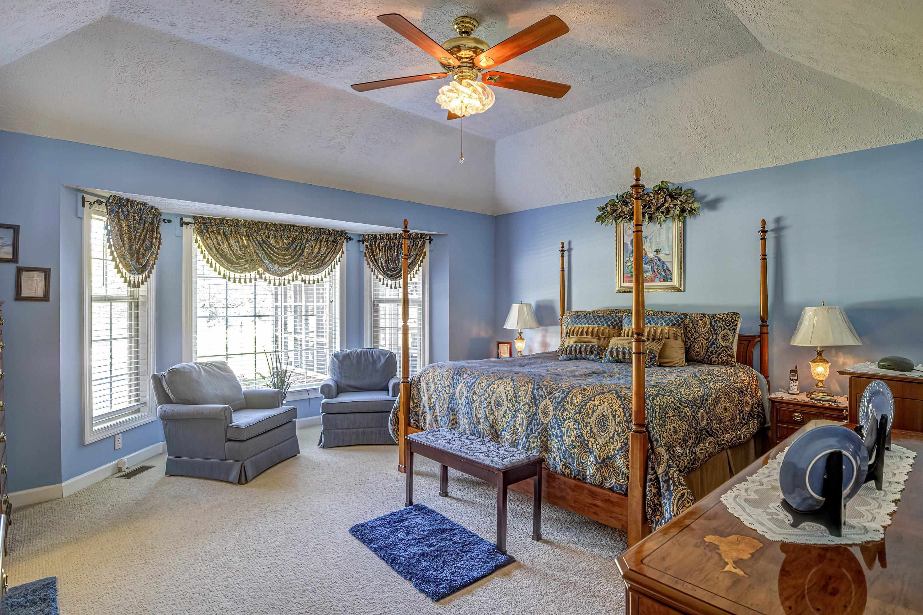 7191 Suttontown Road Faison, NC 28341 - Photo 23 of 40 a bedroom with a bed and ceiling fan