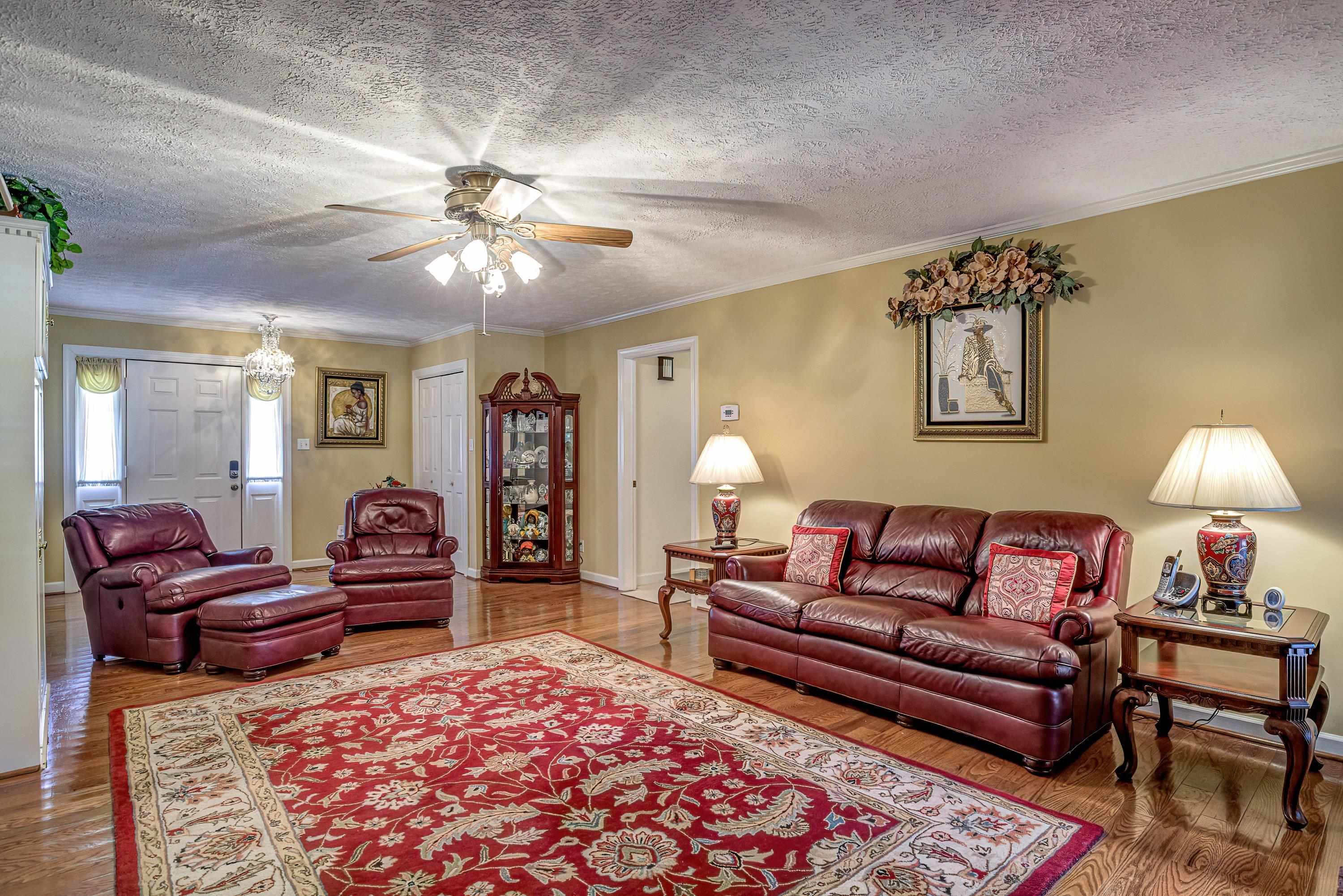 7191 Suttontown Road Faison, NC 28341 - Photo 36 of 40 a living room with furniture and a rug