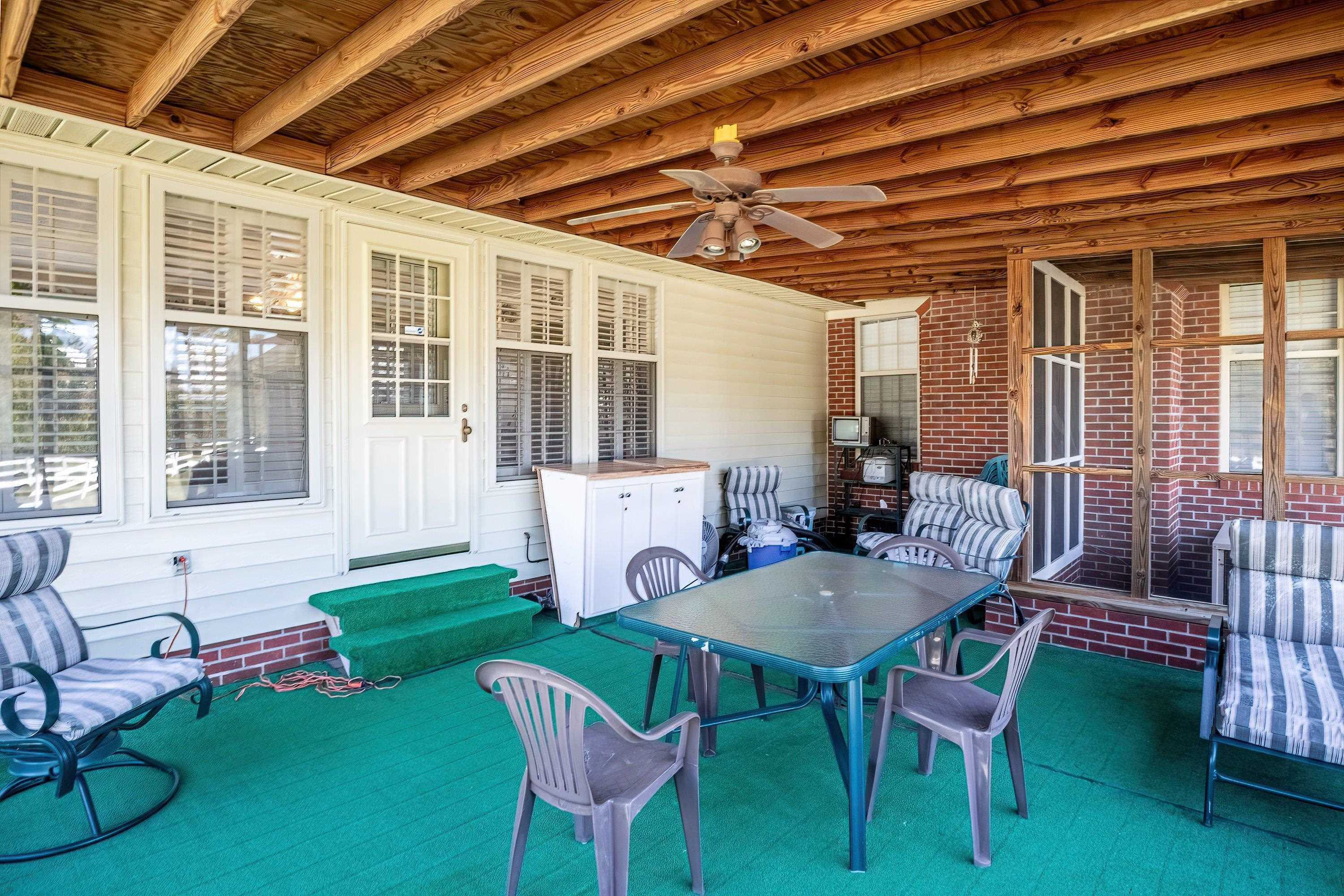 7191 Suttontown Road Faison, NC 28341 - Photo 40 of 40 a view of a house with backyard sitting area and furniture