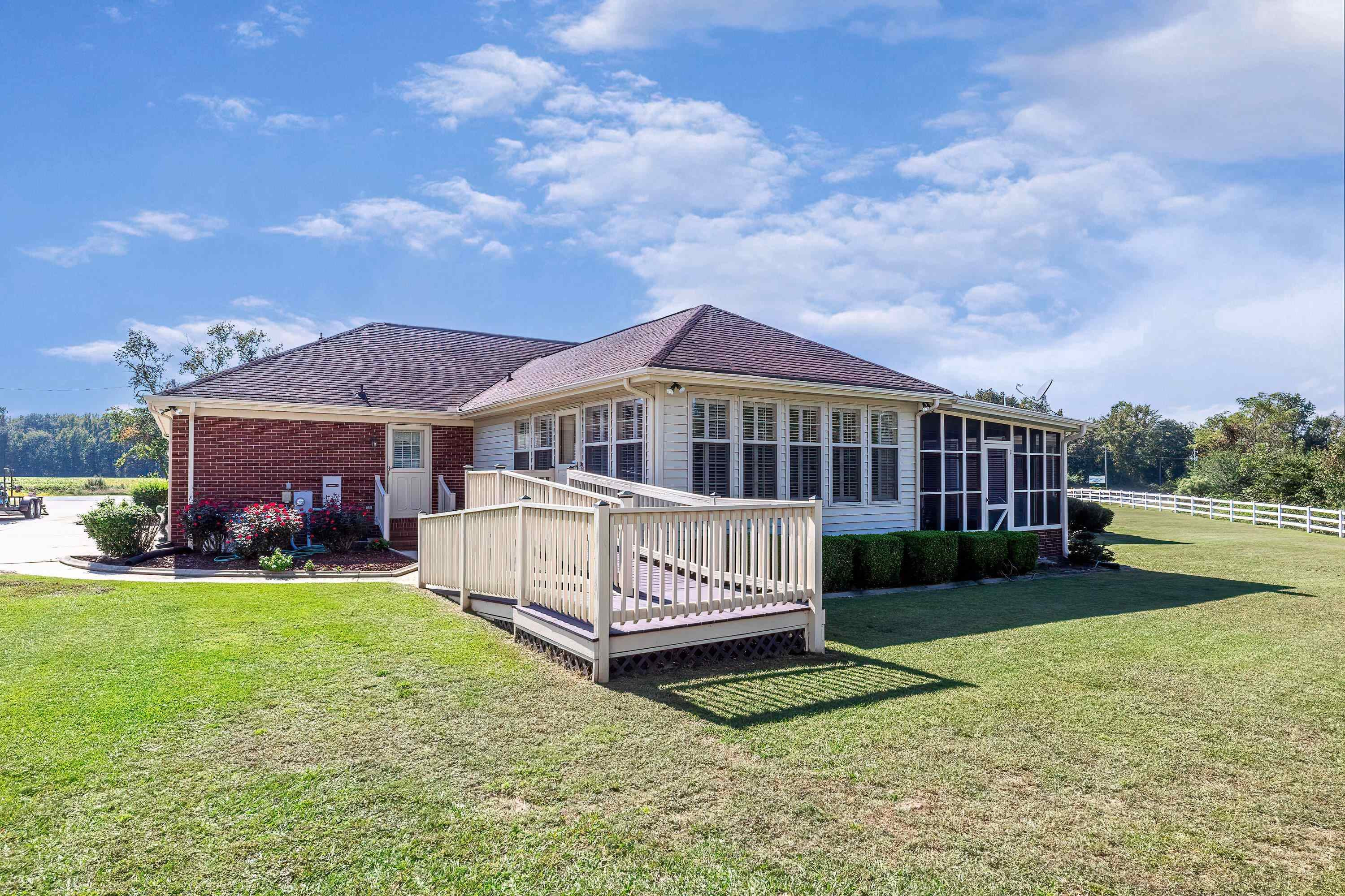 7191 Suttontown Road Faison, NC 28341 - Photo 7 of 40 a view of a house with a yard and sitting area