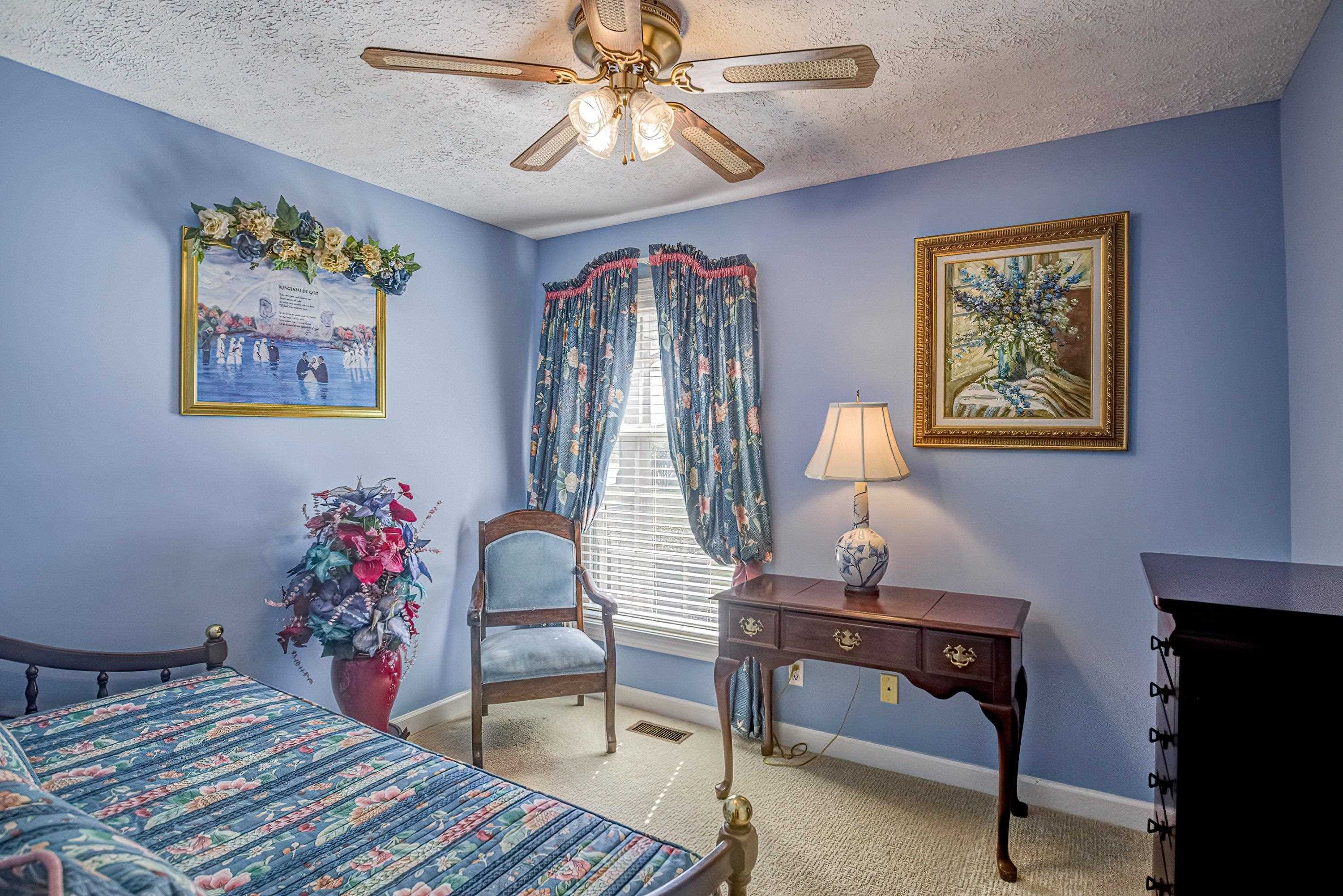 7191 Suttontown Road Faison, NC 28341 - Photo 10 of 40 a bedroom with furniture and wooden floor