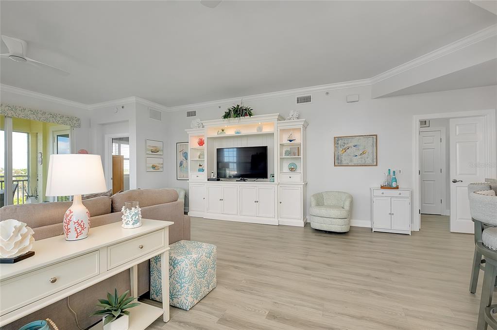 10501 Amberjack Way, Unit 301 Englewood, FL 34224 - Photo 13 of 76 a living room with furniture and a flat screen tv
