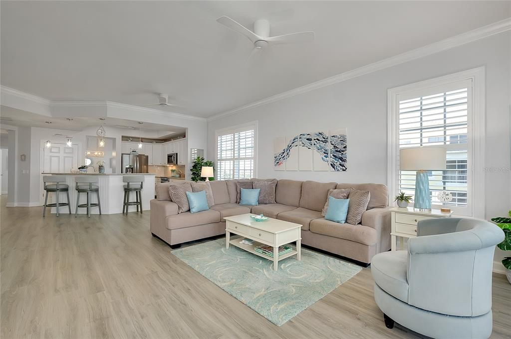 10501 Amberjack Way, Unit 301 Englewood, FL 34224 - Photo 15 of 76 a living room with furniture and a large window