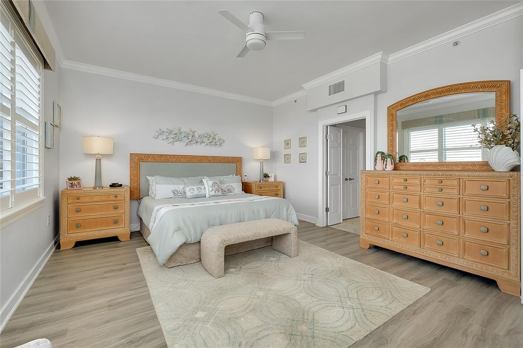10501 Amberjack Way, Unit 301 Englewood, FL 34224 - Photo 20 of 76 a bedroom with a bed and a dresser