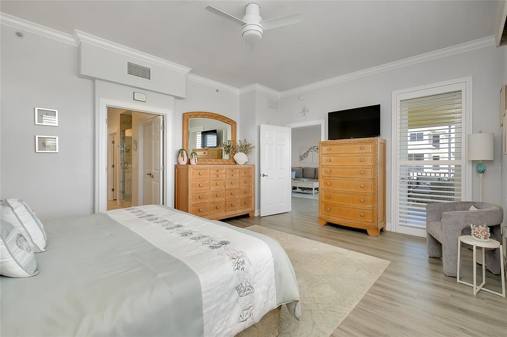 10501 Amberjack Way, Unit 301 Englewood, FL 34224 - Photo 21 of 76 a bedroom with a bed and a flat tv screen