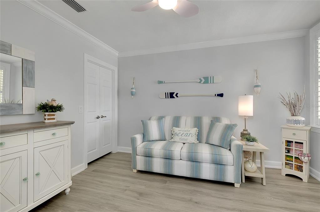 10501 Amberjack Way, Unit 301 Englewood, FL 34224 - Photo 34 of 76 a living room with furniture and wooden floor