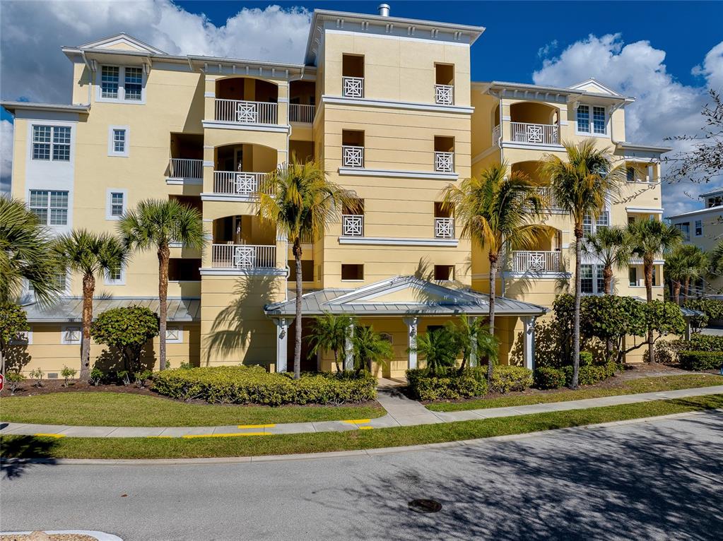 10501 Amberjack Way, Unit 301 Englewood, FL 34224 - Photo 45 of 76 a front view of a building with street