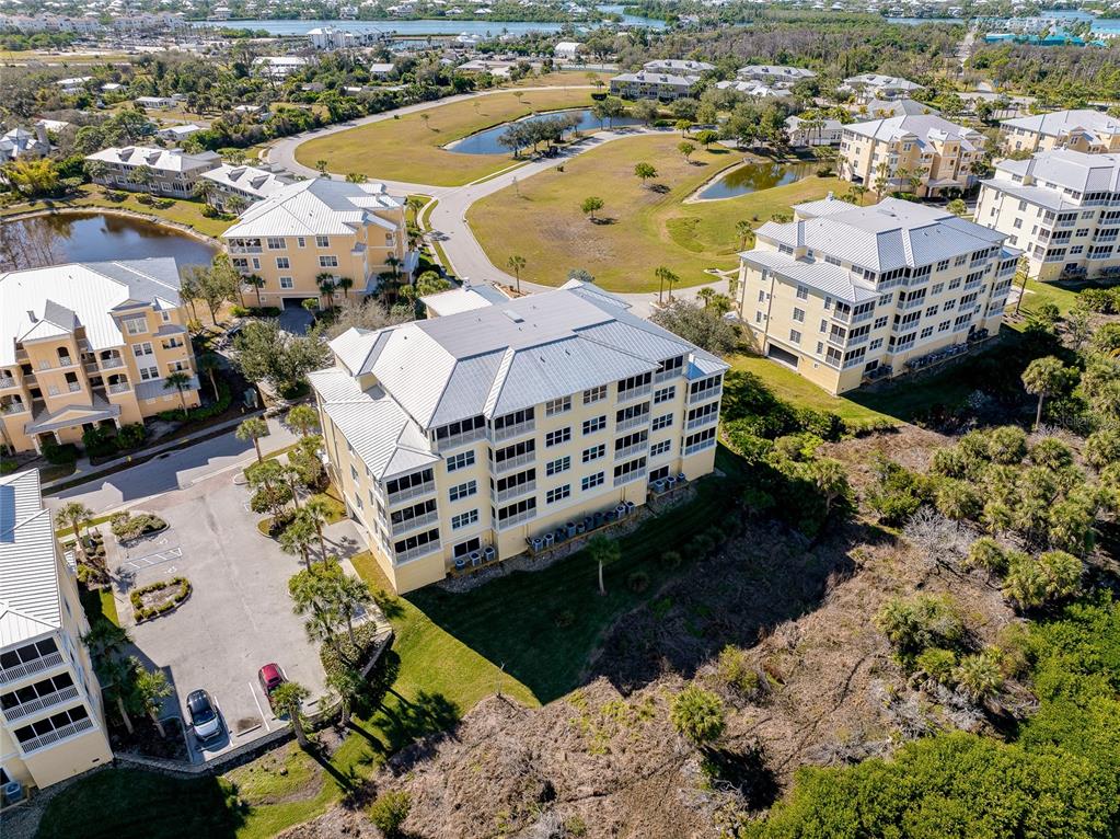 10501 Amberjack Way, Unit 301 Englewood, FL 34224 - Photo 51 of 76 an aerial view of residential houses with outdoor space