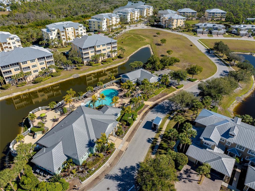 10501 Amberjack Way, Unit 301 Englewood, FL 34224 - Photo 54 of 76 an aerial view of lake and residential houses with outdoor space