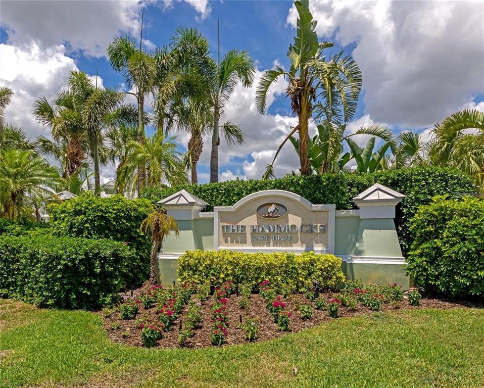 10501 Amberjack Way, Unit 301 Englewood, FL 34224 - Photo 60 of 76 front view of a house with a yard
