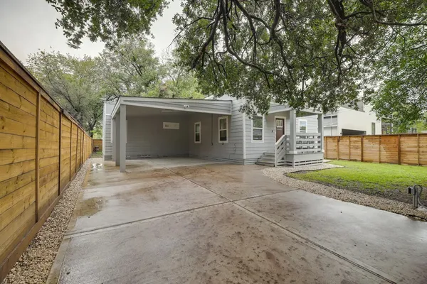 a house with trees in front of it